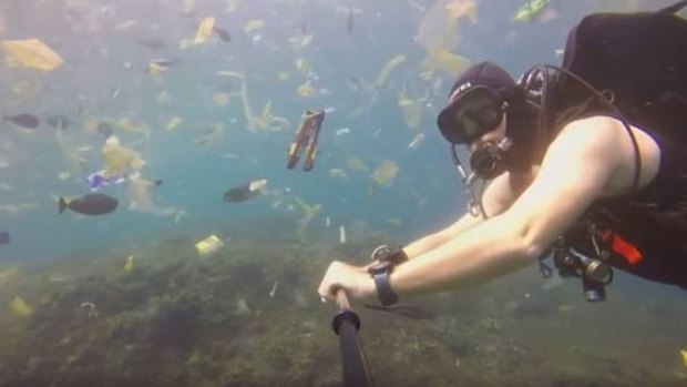 British diver Rich Horner swims through the polluted sea.