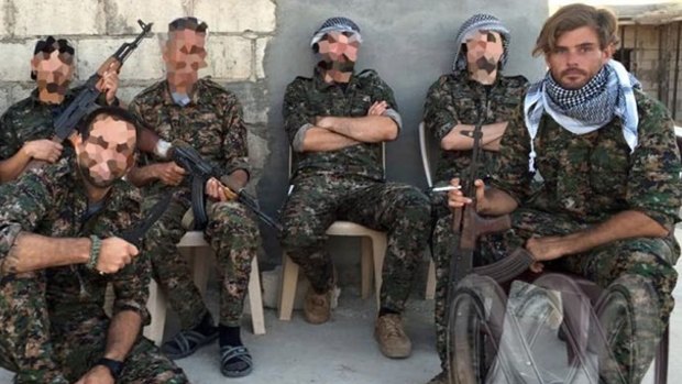 Reece Harding with Kurdish fighters. 
