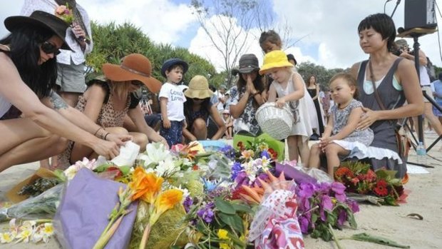 There was a large turnout at Shelly Beach on Saturday morning for the memorial service of local surfer Tadashi Nakahara who died in a shark attack at the popular surfing spot.