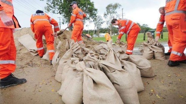 State Emergency Service workers use sandbags to counter flooding in NSW.