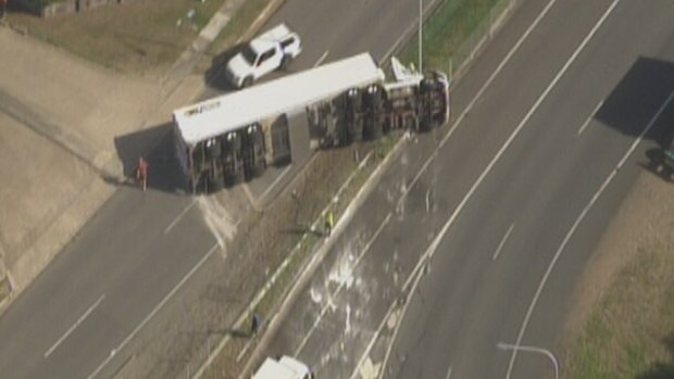 A semi-trailer has rolled over at Rocklea.