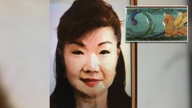 Annabelle Chen and one of the tiles found inside the suitcase dropped at the Fremantle Traffic Bridge.
