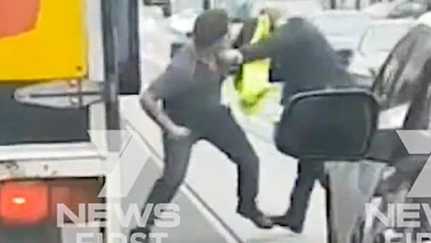 Dash cam footage of two men brawling in South Yarra on Tuesday morning.