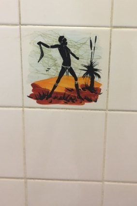 A photograph supplied by ACT Labor politician Bec Cody showing one of the tiles in the  men's urinal at the Sussex Inlet RSL, which she says is a disgrace.
