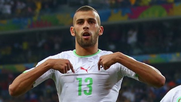 Outstanding talent ... Islam Slimani of Algeria celebrates scoring against Russia.