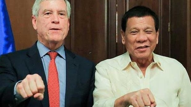 Australia's spy chief Nick Warner with Philippine president Rodrigo Duterte in Manila. 