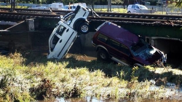 Five people died after they drove through floodwaters north of Brisbane.
