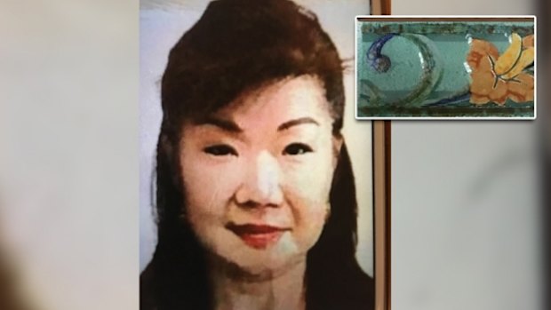 Annabelle Chen and one of the tiles found inside the suitcase dropped at the Fremantle Traffic Bridge.