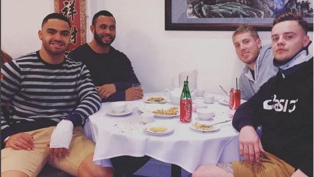 Dylan Walker, left, Aaron Gray (second from right) and Jake O'Sullivan (right) at dinner in an Instagram post published by Walker.
