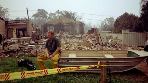 Mr Dutkiewicz at the scene of his house that was destroyed in the 2003 Canberra fires, picture taken by his mum, Carol Dutkiewicz.