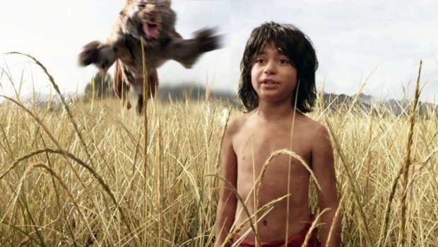 Pounce like a tiger ... Shere Khan looks to ambush Mowgli (Neel Sethi) in <i>The Jungle Book</i>.