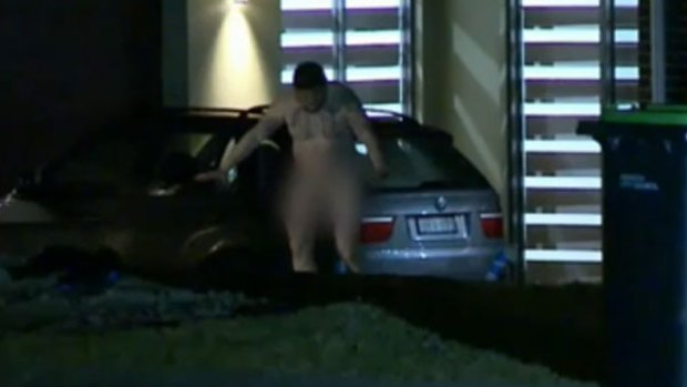 A naked man emerges from the home in Luddenham after a home invasion.