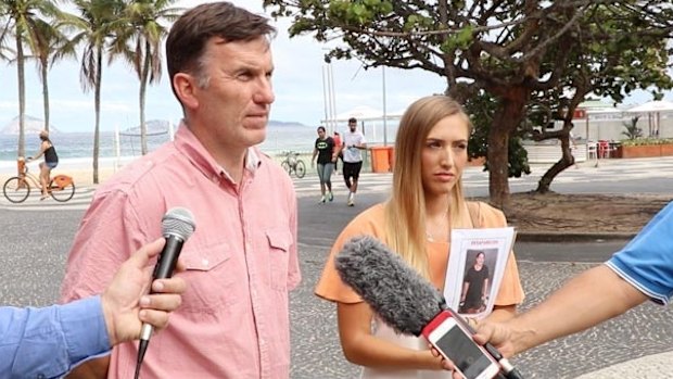 Rye Hunt's uncle Michael Wholohan and girlfriend Bonnie Cuthbert speaking with reporters in Rio de Janeiro.