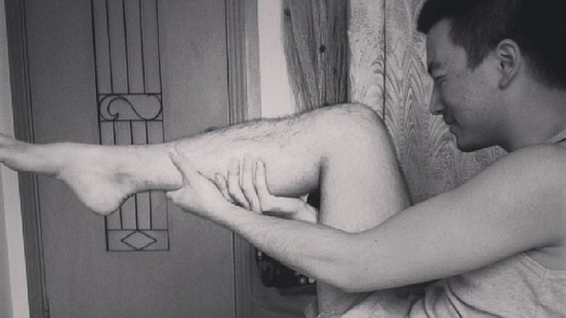 Chinese artist Ai Weiwei is posting photos of people adopting the 'legs-as-guns' pose.