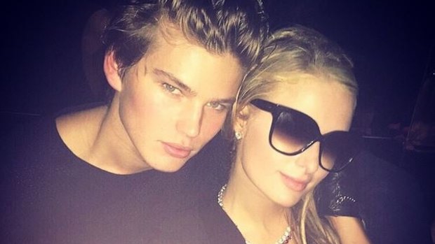 Paris Hilton with Jordan Barrett at the Roberto Cavalli fashion show.