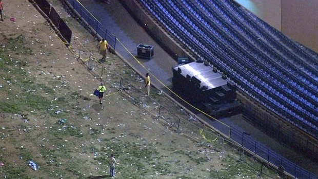 Caution tape can be seen across a gap in railing it collapsed during a concert by Snoop Dogg and Wiz Khalifa.