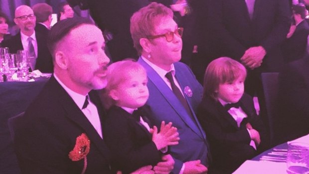Happy family: Elton John and David Furnish with their two sons at the Elton John AIDS Foundation Oscars Viewing Party.