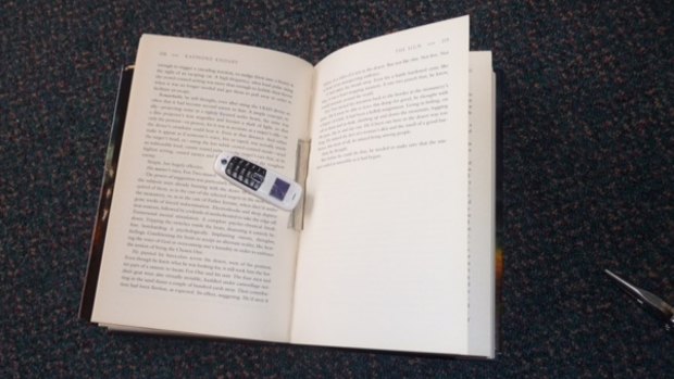 The phone discovered inside the spine of a book earlier this month.