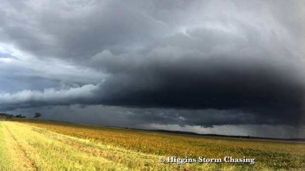 Afternoon storms roll across fields south of Toowoomba on Sunday.