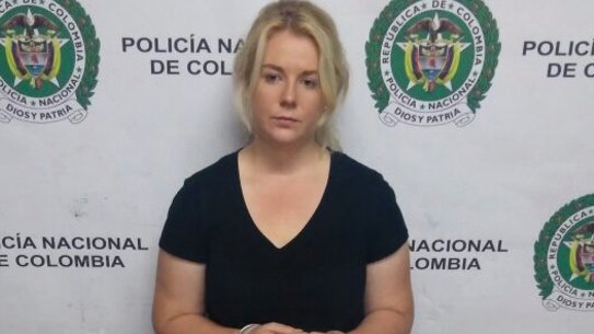 Colombian police released this photo of Cassandra Sainsbury with the drugs she is said to have smuggled.