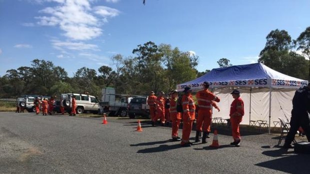 SES crews prepare to scour bushland in Walloon on Thursday.