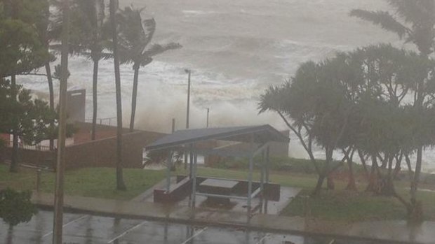 Waves break over the sea wall at Yeppoon on Friday.