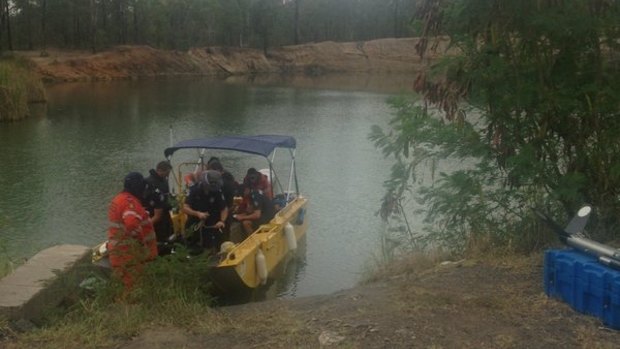 Search crews scour the quarry for the body of 16-year-old Goodna boy Duncan Wilmott. 
