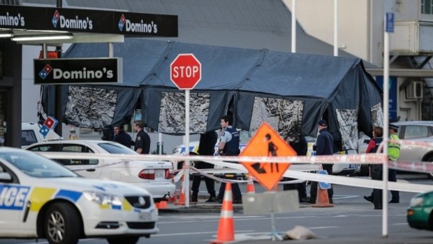 A tent is moved into place in Upper Hutt where the gunman's body lay.