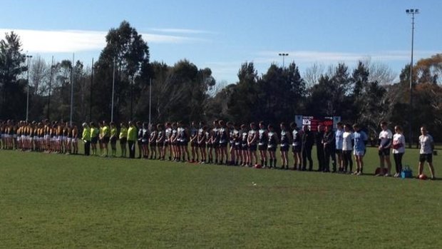 Queanbeyan and Belconnen share a moment's silence to remember Adelaide Crows coach Phil Walsh.
