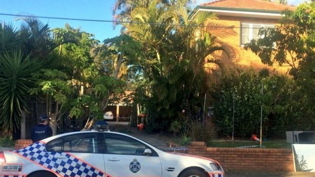 Police at the front of the Wooloowin unit block on Wednesday morning.