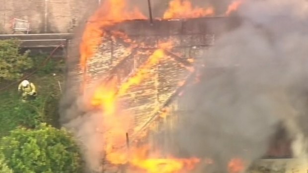 Firefighters are working to control a blaze at Ashgrove in Brisbane's north-west.