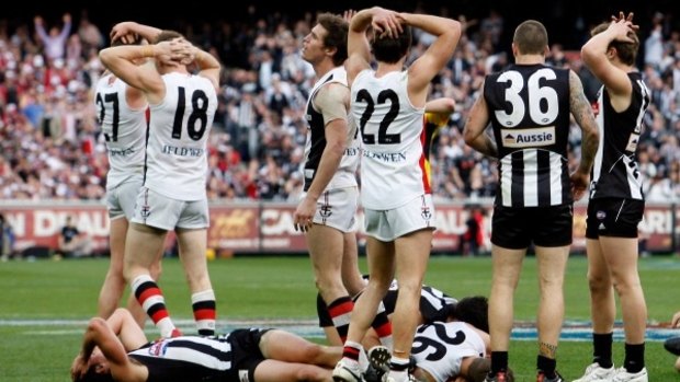 Shattered Saints and Magpies players throw up their arms in stunned confusion after the final siren.
25 September 2010

