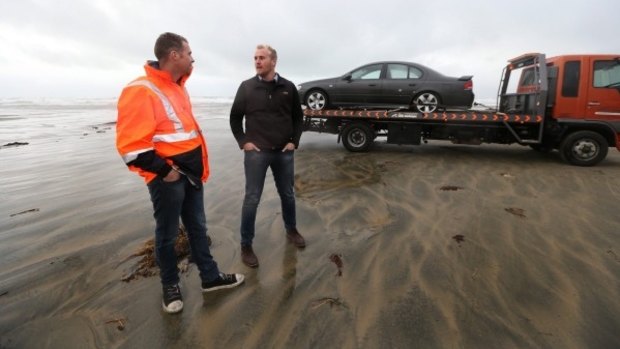 Salvage driver Melvin Butler, left, and car salesman Jared Bekhuis on Oreti Beach.