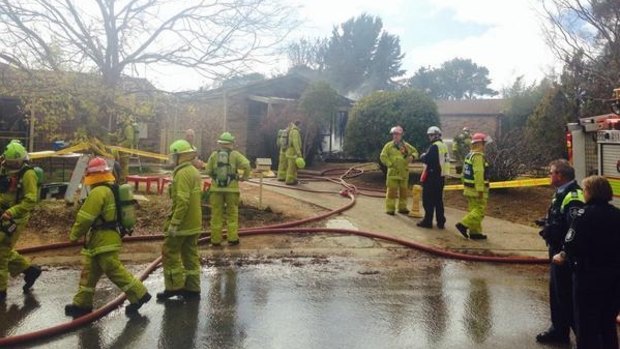 Firefighters at the scene of a McKellar house destroyed by fire