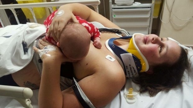 Danni Bett breastfeeding two-month-old Indi Nathan in Christchurch Hospital after being in a car crash.
