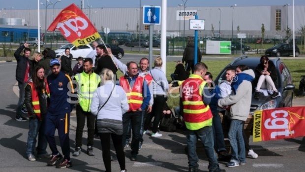 Strikers block access to the Amazon warehouse to protest against labour and employment law reforms on Thursday in Lauwin-Planque near Douai, France. 