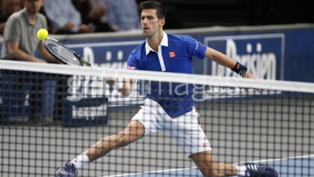 Novak Djokovic in action against Tomas Berdych in Paris.