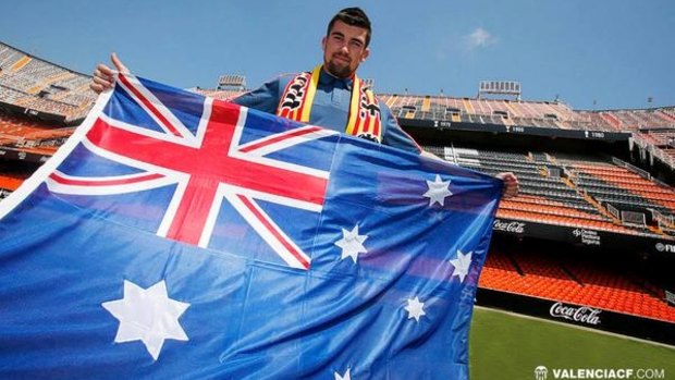 Mat Ryan brandishes the Australian flag at his new club Valencia.