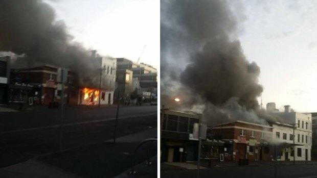 Smoke billows from The Albion Rooftop bar and lounge on the corner of York Street in South Melbourne.