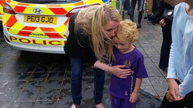 Reunited: Emma and Leon back together after the three-year-old became lost in the crowd. 