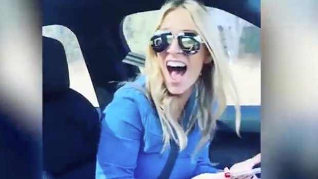 Dangerous: Sam Burgess' wife Phoebe notices the footballer filming her apparently while he is driving.