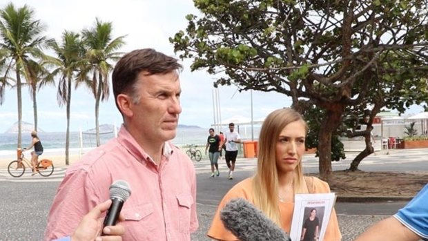 Rye Hunt's uncle Michael Wholohan and girlfriend Bonnie Cuthbert speaking with reporters in Rio de Janeiro.
