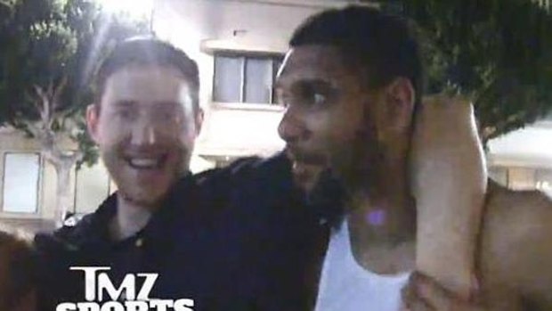 Aron Baynes is helped out by Spurs teammate Tim Duncan.