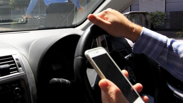 A driver going 60km/h who looks down at the phone for two seconds travels more than 30 metres blind.