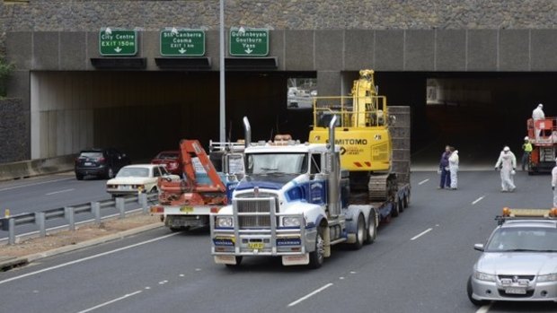 The truck and excavator are freed from the Acton Tunnel after being stuck for two days.