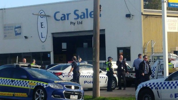 The scene at G.E.L Motors in Separation Street, North Geelong where a police officer's gun was discharged in the holster.