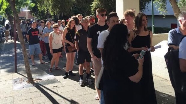 Crowds queue down Hay Street to buy vinyl records at the 6PR bushfire appeal album sale.