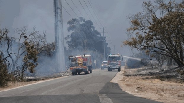 Firefighters battle a large bushfire in Bullsbrook.