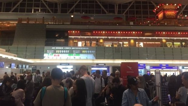 Shane Miles was stuck in a huge queue at Haneda Airport in Japan after Qantas experienced problems with its check-in systems.