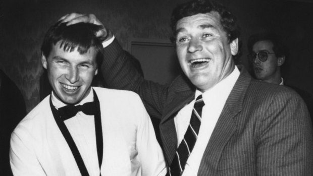 Paul Couch celebrates his 1989 Brownlow Medal with Alistair Lord.